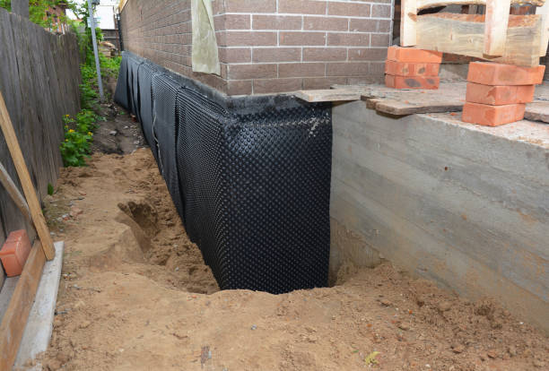 SJ Waterproofing Pros technician performing targeted Sump Pump Installation assessment in Kenton, OH